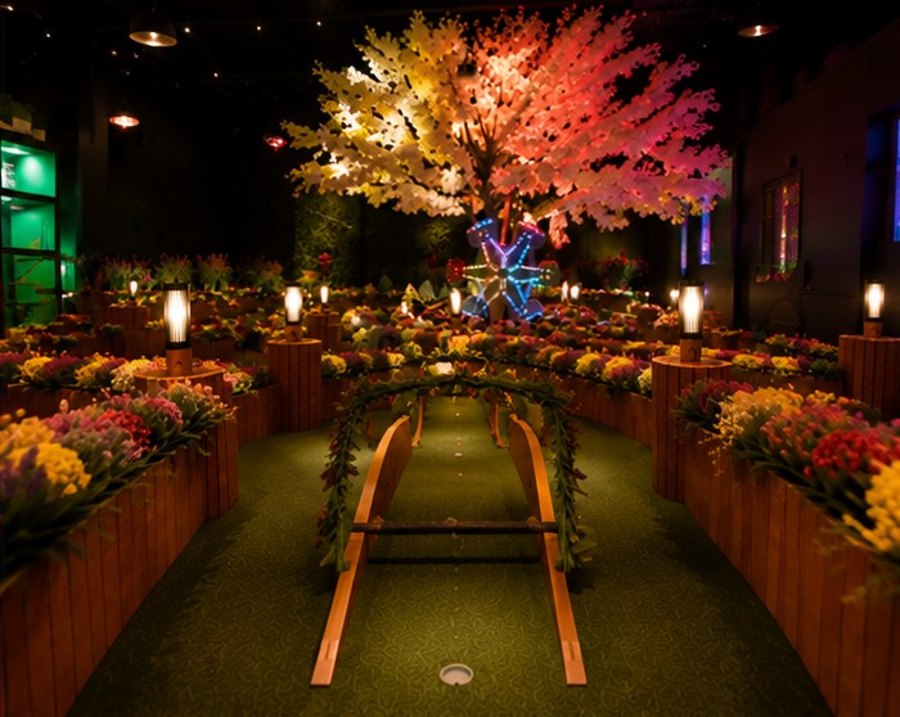 Blossom fairway with a wooden ramp and garland arch